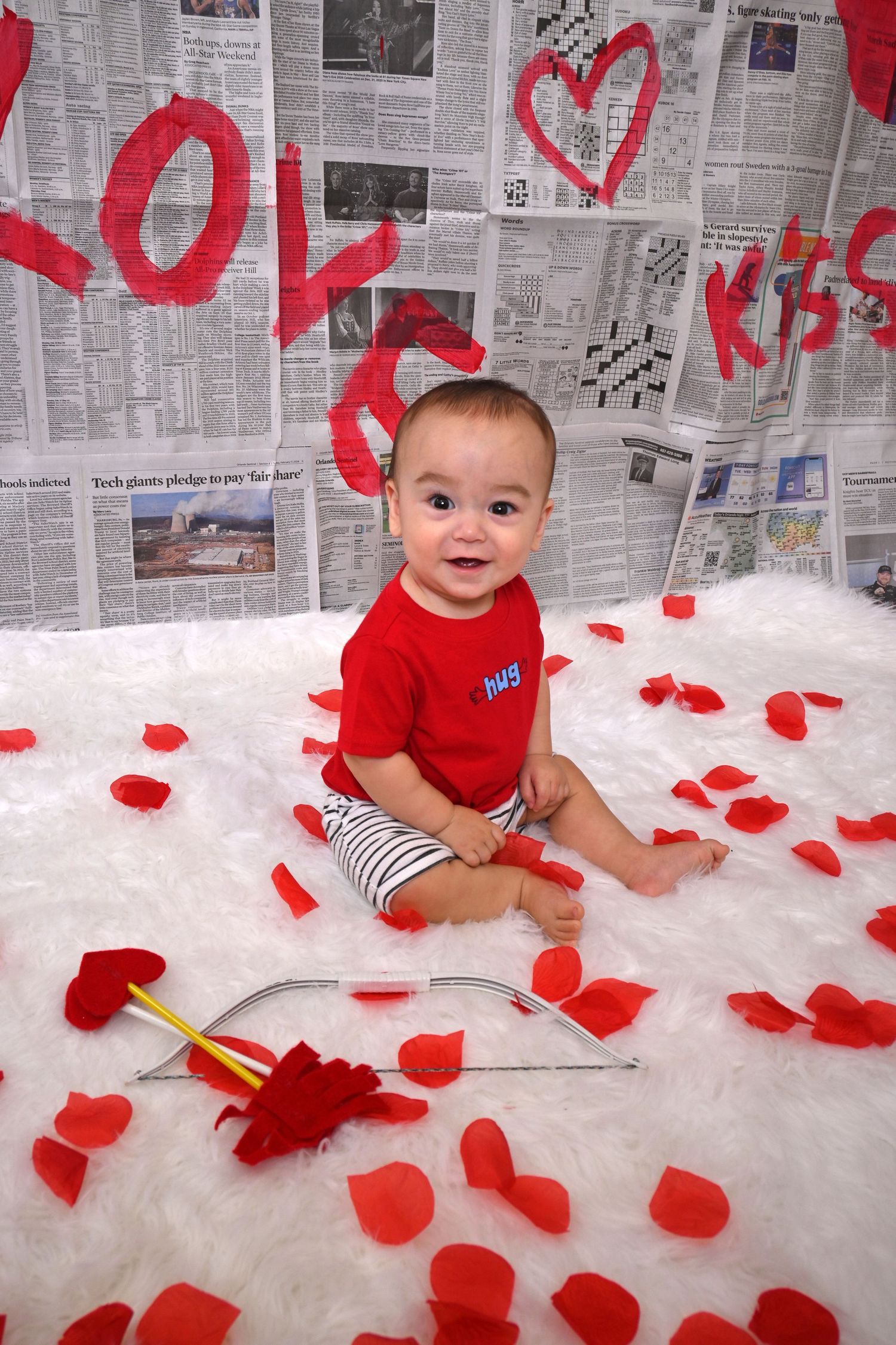 Baby celebrating Valentine's Day surrounded by rose petals during a milestone session by a Central Florida Photographer.