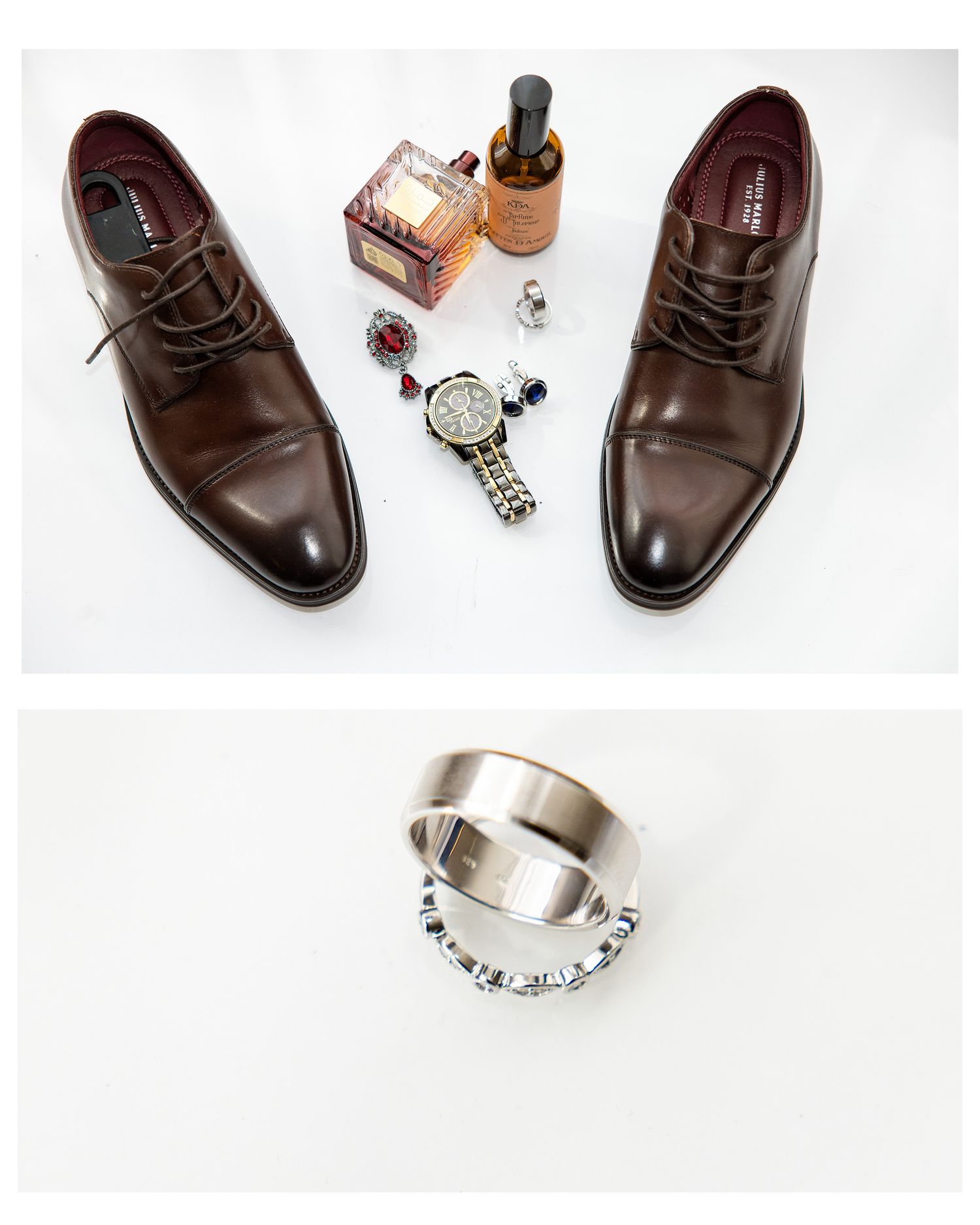 Brown leather dress shoes, cologne, cufflinks, watch, and wedding rings arranged for a groom's wedding day flat lay.