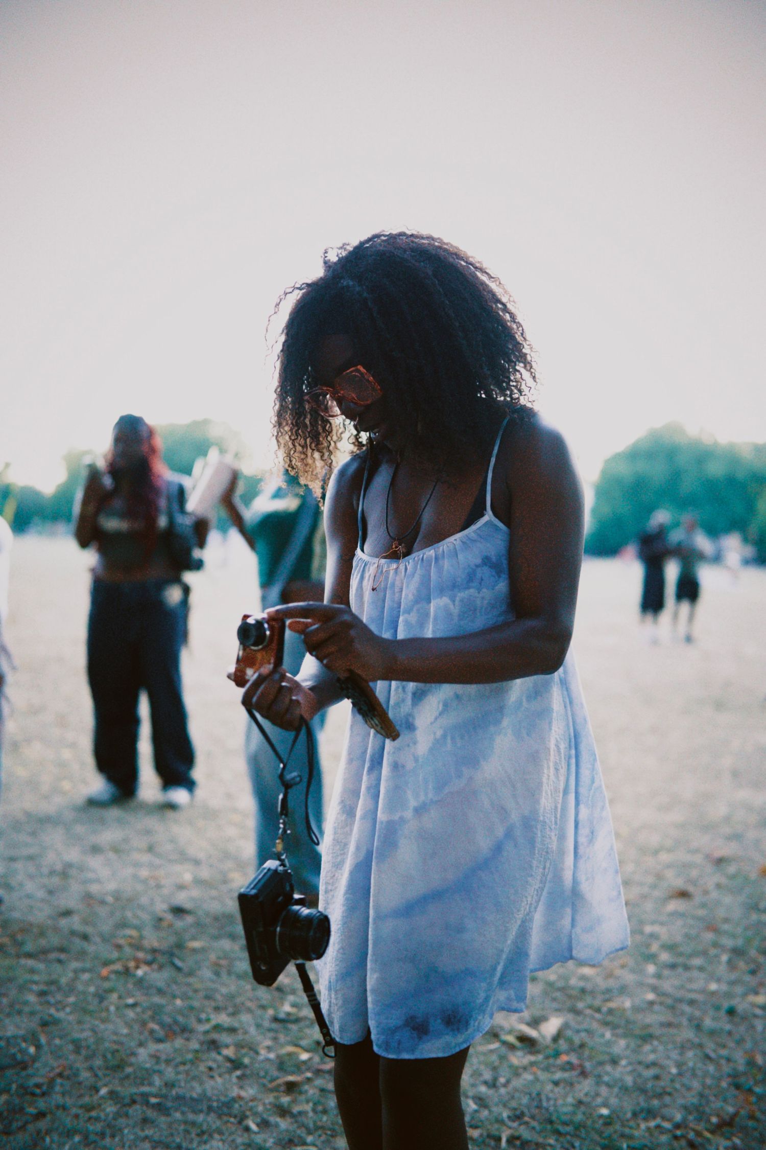 Behind the scenes shot of photographer working at outdoor London event by ARIETA Studios. (93 chars)