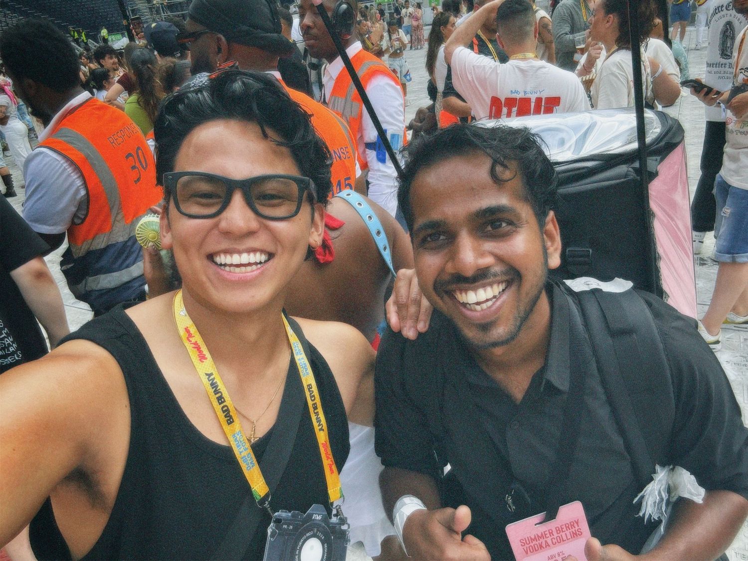 Two men smiling together outdoors at London music event by ARIETA Studios.