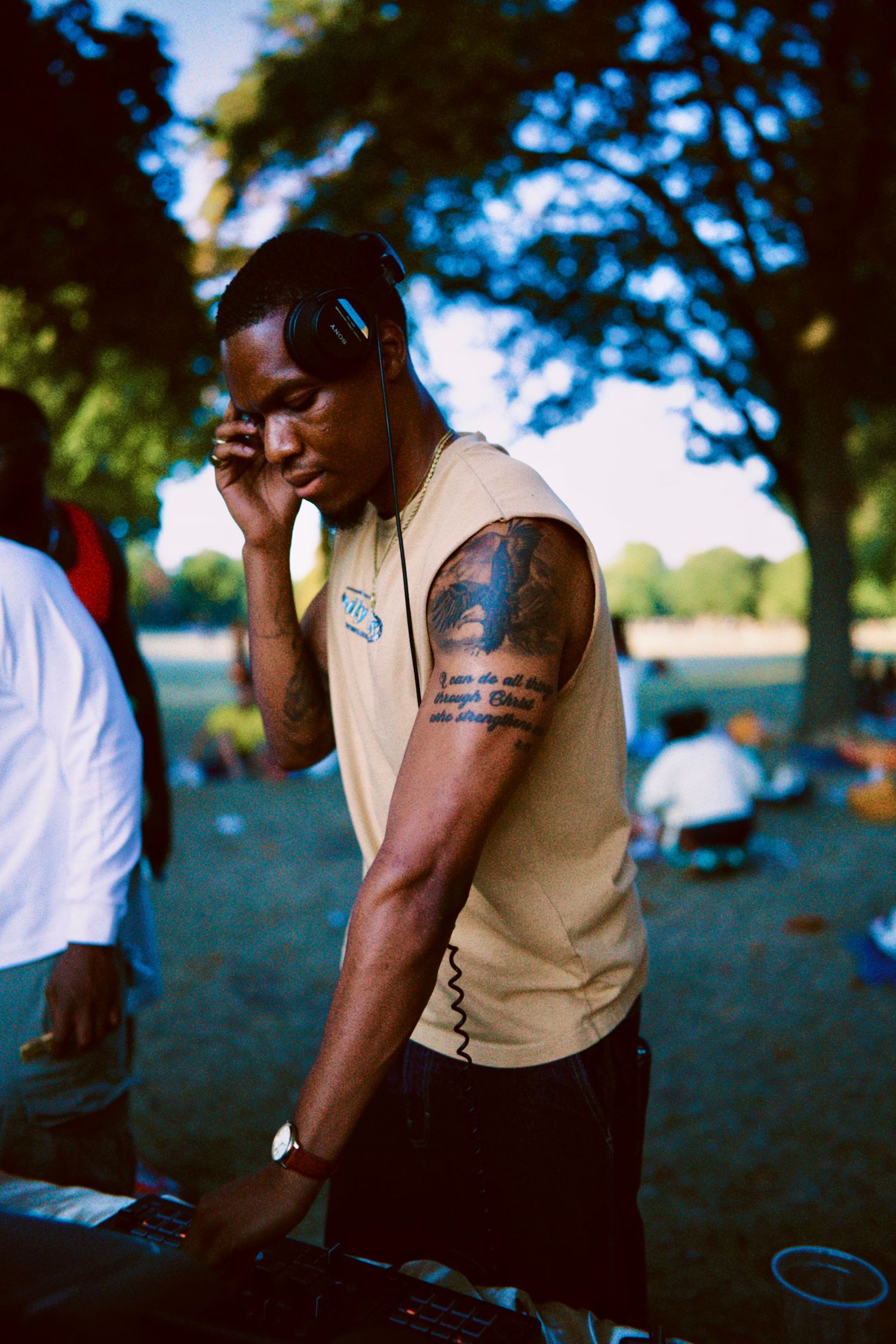 DJ Wray PressPlay , a man performing outdoors at summer community festival covered by ARIETA Studios.