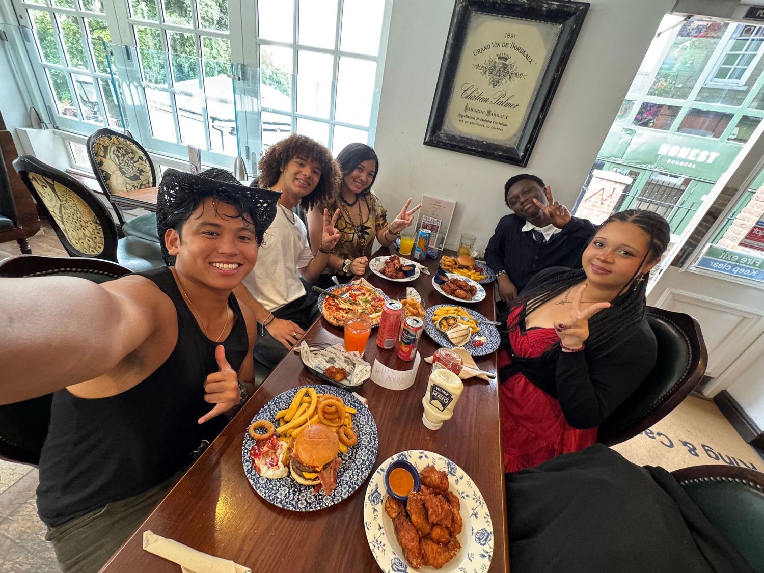 Sharing lunch and burgers around a restaurant table in Windsor.