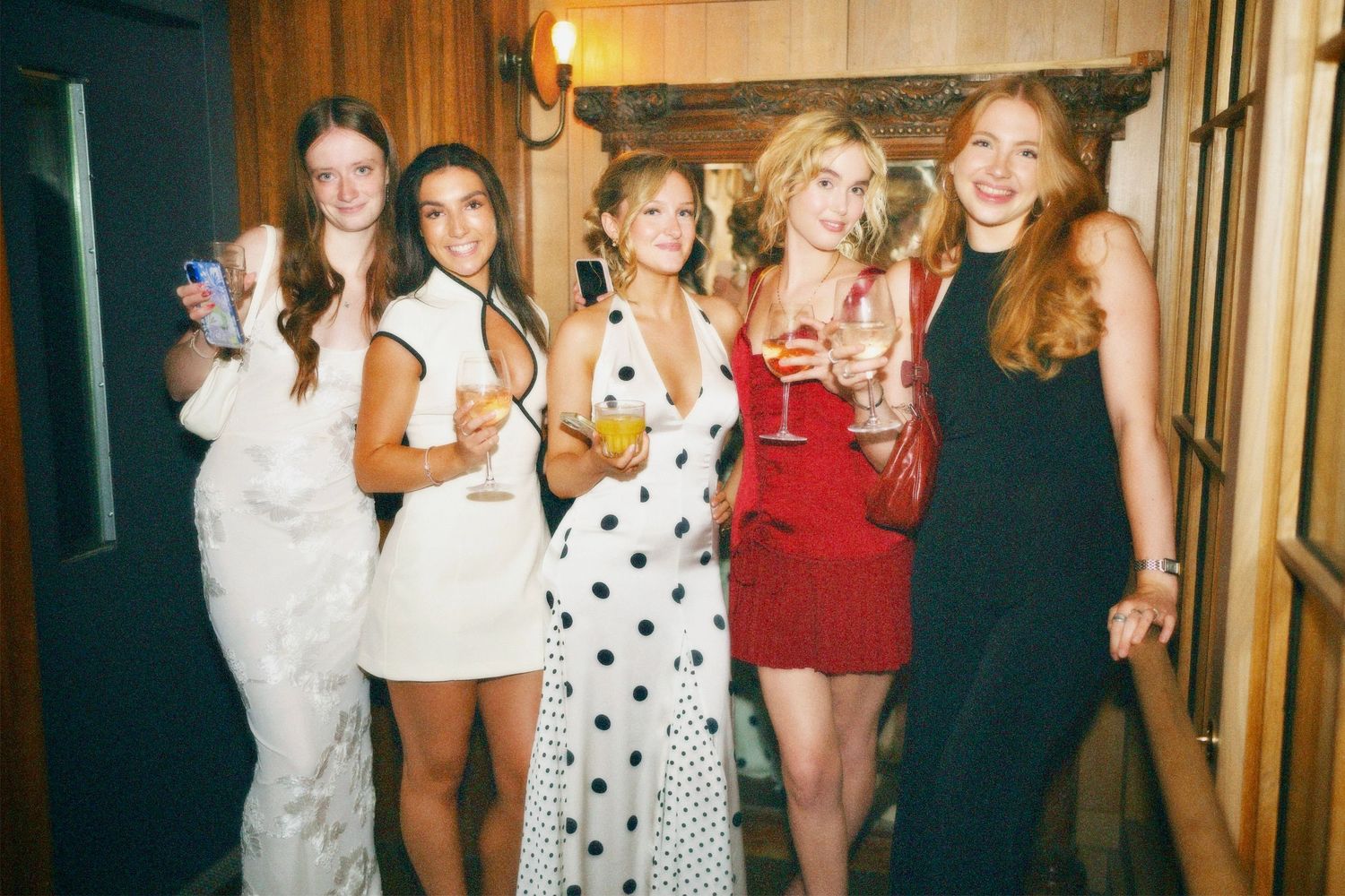 Group of women dressed up celebrating at Amelia Hurst 21st birthday by ARIETA Studios.