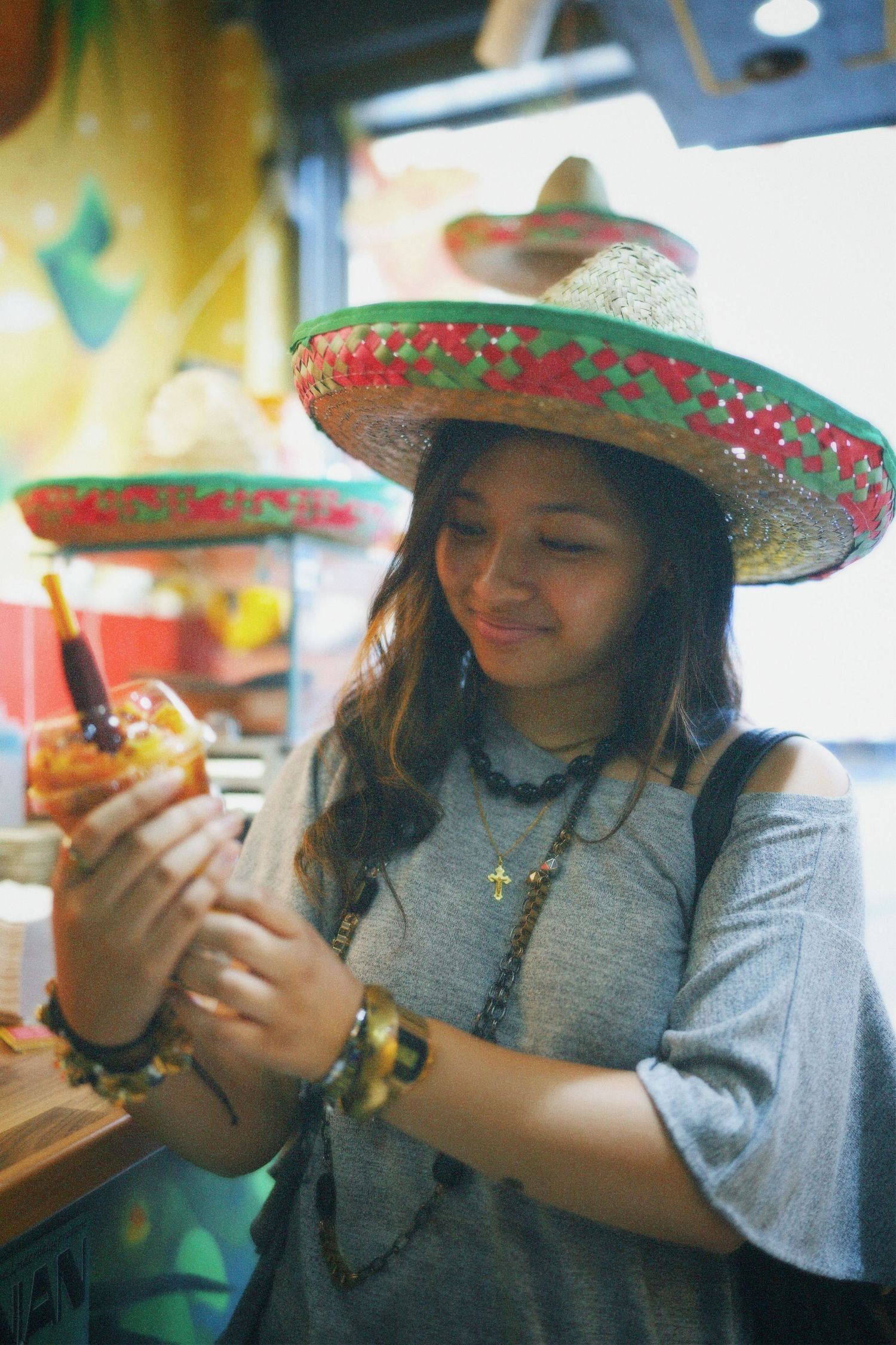 Alvernia Arieta in a sombrero holding a Chamigos fruit slushie captured for commercial media by ARIETA Studios.