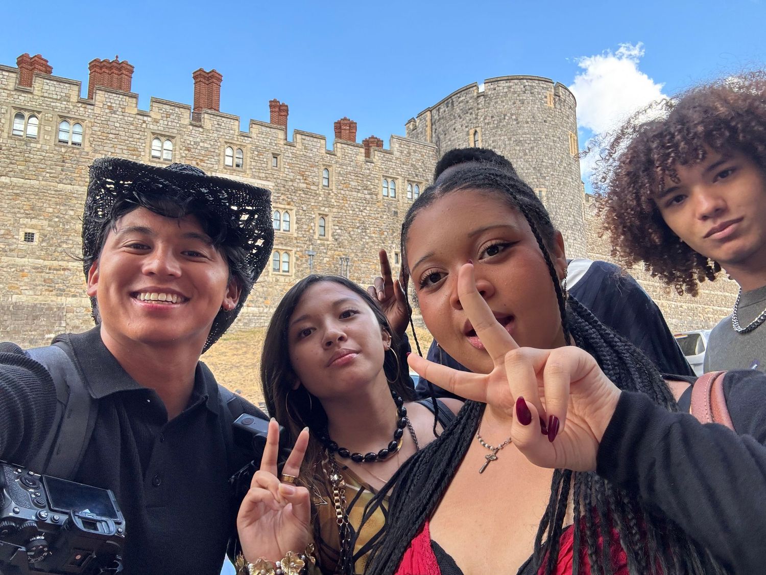 Group selfie with Alastair and the crew in front of Windsor Castle walls.