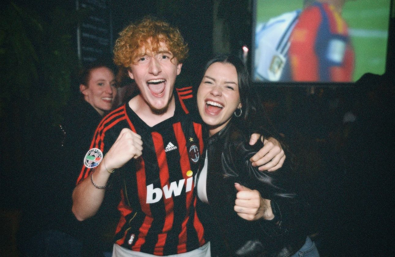 Cheering fans celebrating Spain's victory at the World Cup Finals pub screening captured by ARIETA Studios.