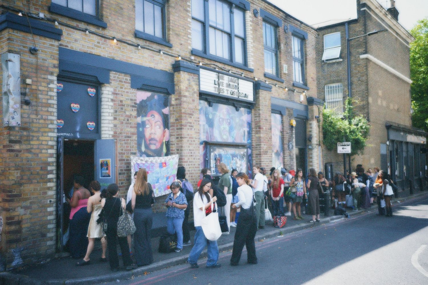 Long queue of attendees lined up along Kingsland Road waiting to enter the Fashion For Future swap