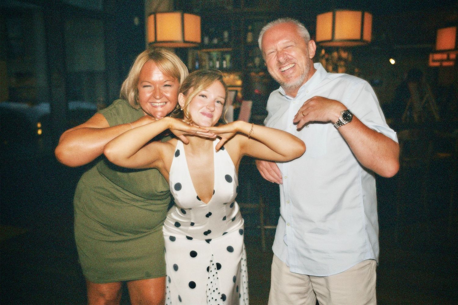 Candid portrait of party host with parents at London 21st birthday celebration captured by ARIETA Studios.