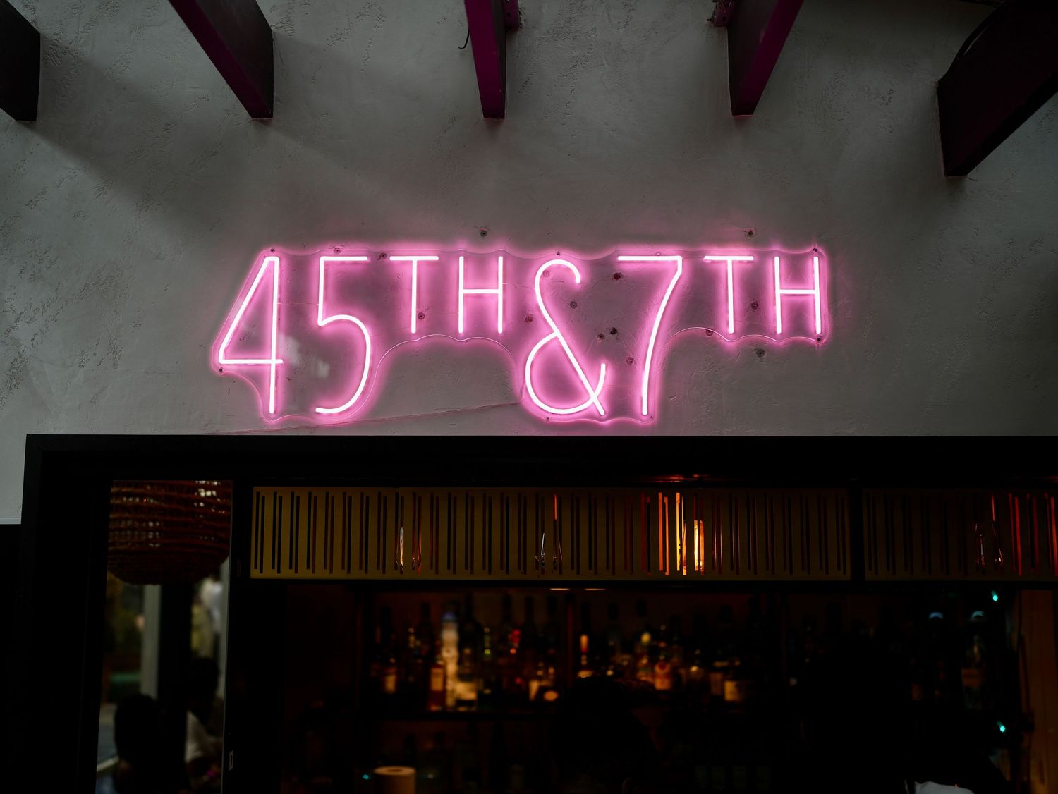 A glowing pink neon sign reading 