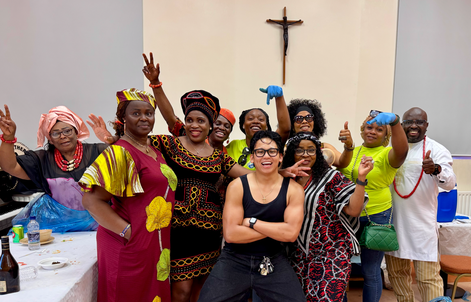 Large group pose with guests and ALASTAIR ARIETA the photographer in traditional attire at Culture Day by ARIETA Studios.