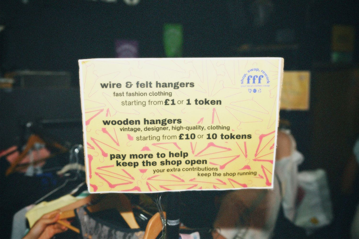 Poster displaying the pricing and token guide sign explaining hanger values at the Fashion For Future exchange