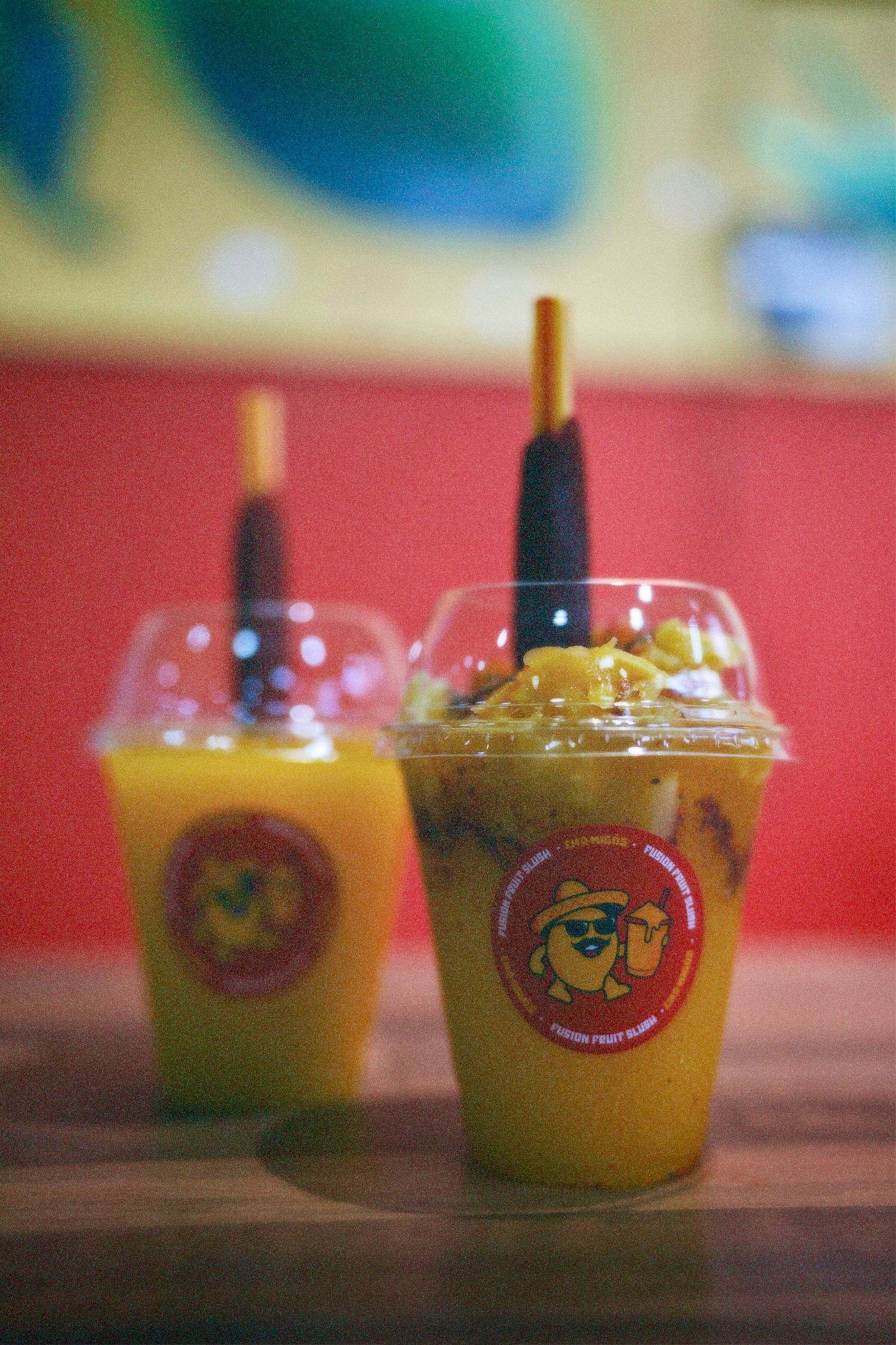 Close-up shot of Chamigos mango fusion fruit slush drinks with toppings taken by ARIETA Studios in London.