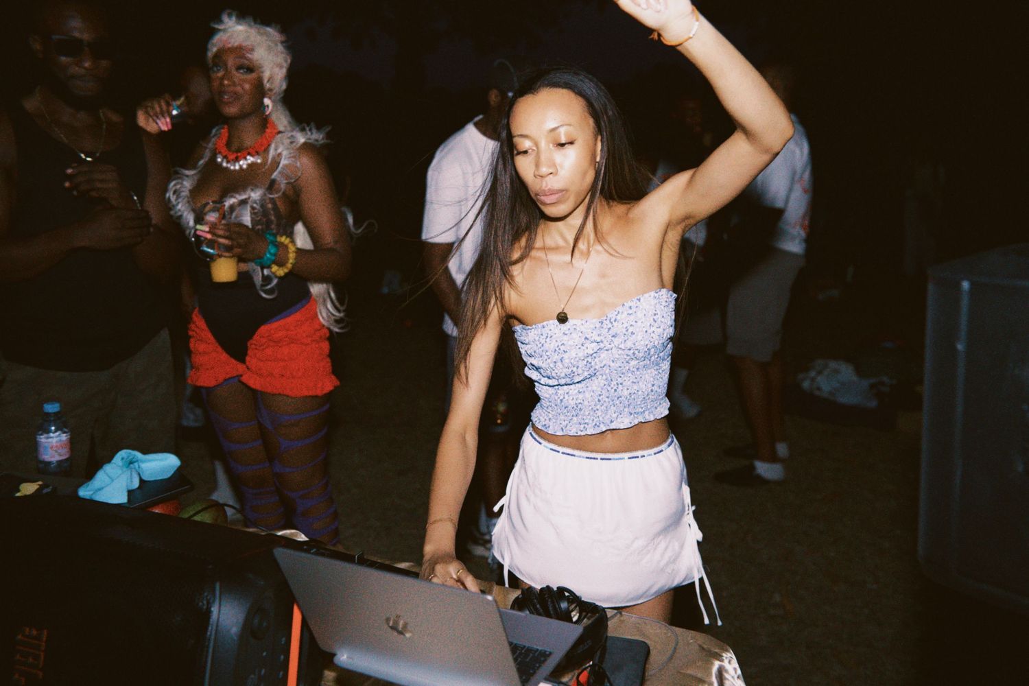 DJ Rush Hour, a woman performing set at outdoor summer event captured by ARIETA Studios.
