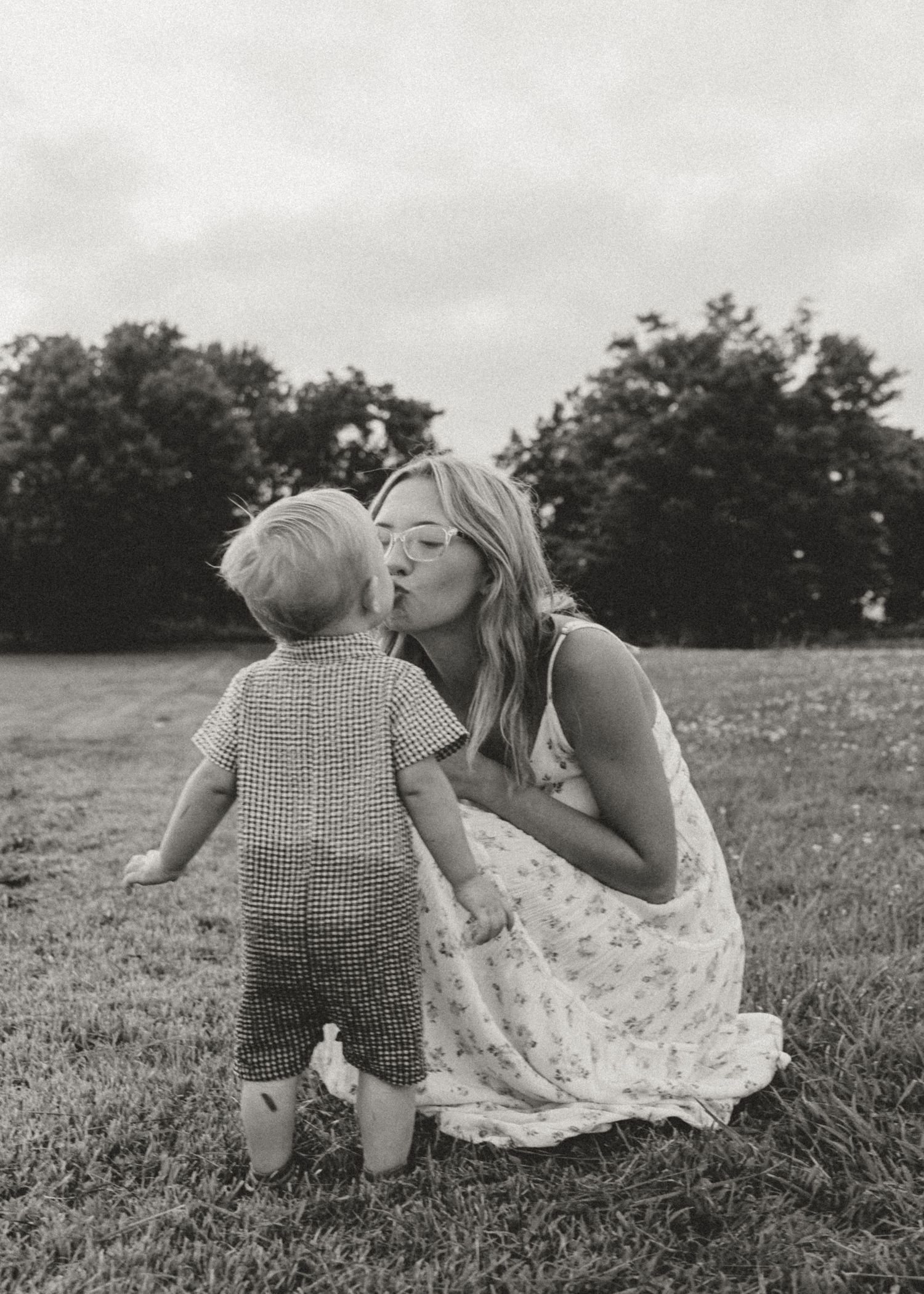 Mom giving son a kiss. bond between mom and son