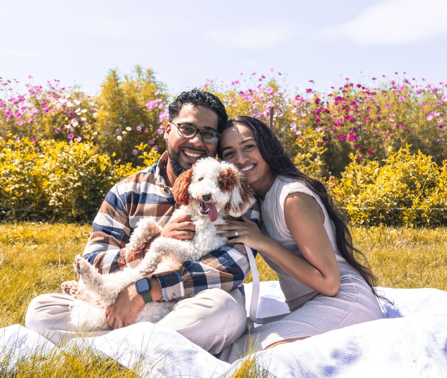 Family standing in a blooming sunflower field at Pingle's Farm Market in Oshawa
