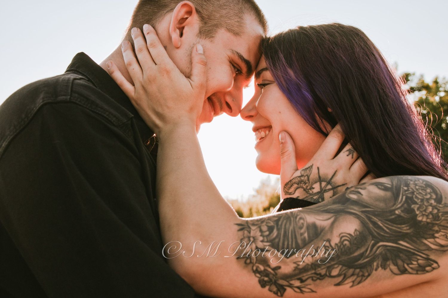 Close-up shot of a couple embracing with a visible engagement ring in Durham Region
