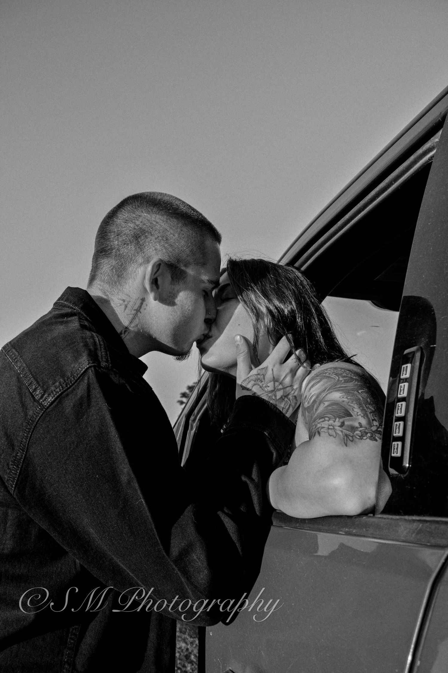Close-up shot of a couple embracing with a visible engagement ring in Durham Region