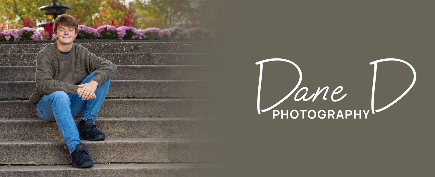 Young man sitting on stone steps outdoors, Dane D Photography portrait session.