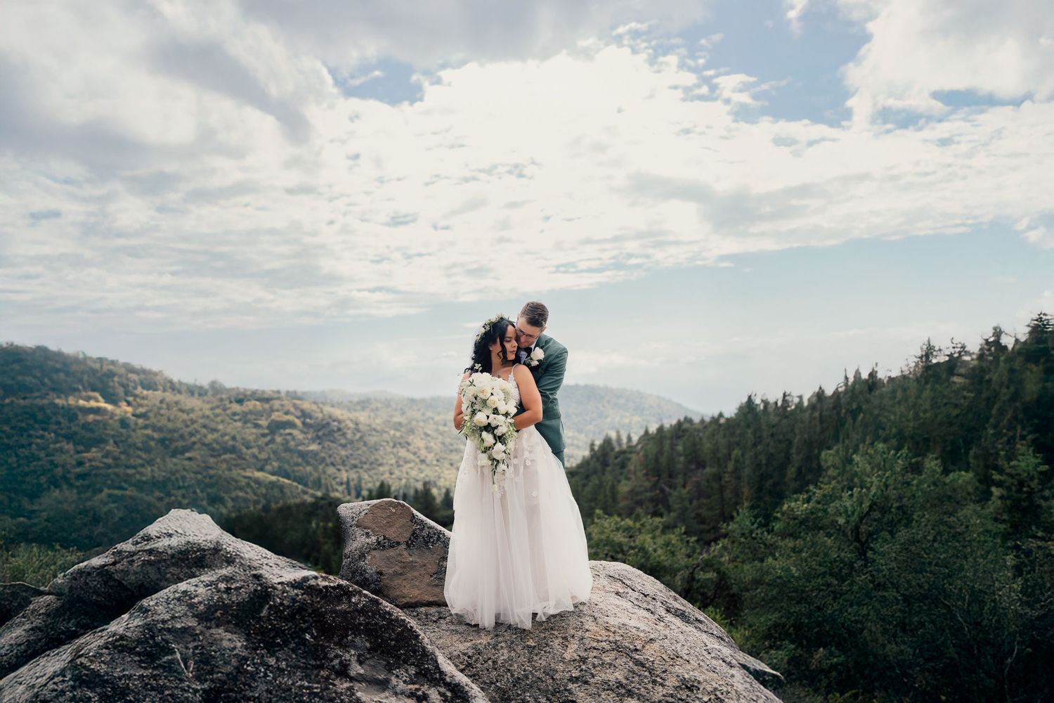 Idyllwild Elopements, nature ceremony, surrounded by nature, couple embraced on mountain top in idyllwild CA