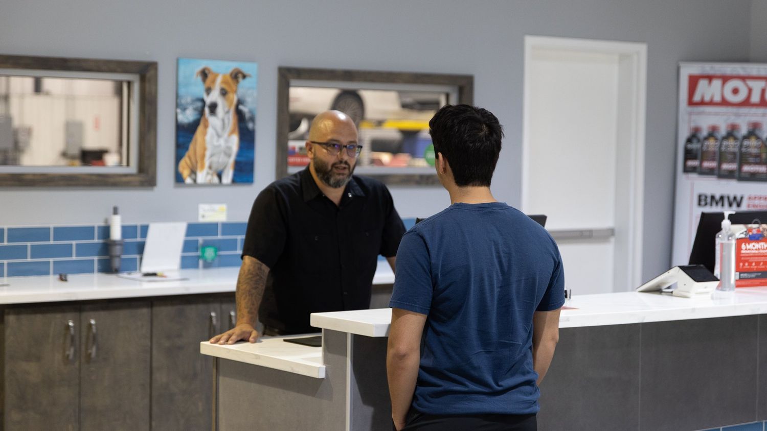 Service advisor greeting a customer at ABR Houston