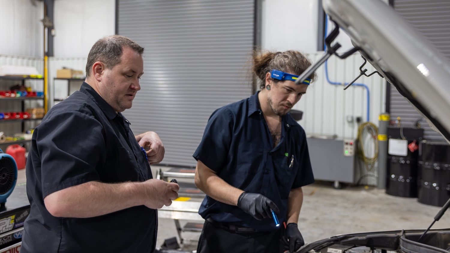 Two ABR Houston technicians reviewing a repair together