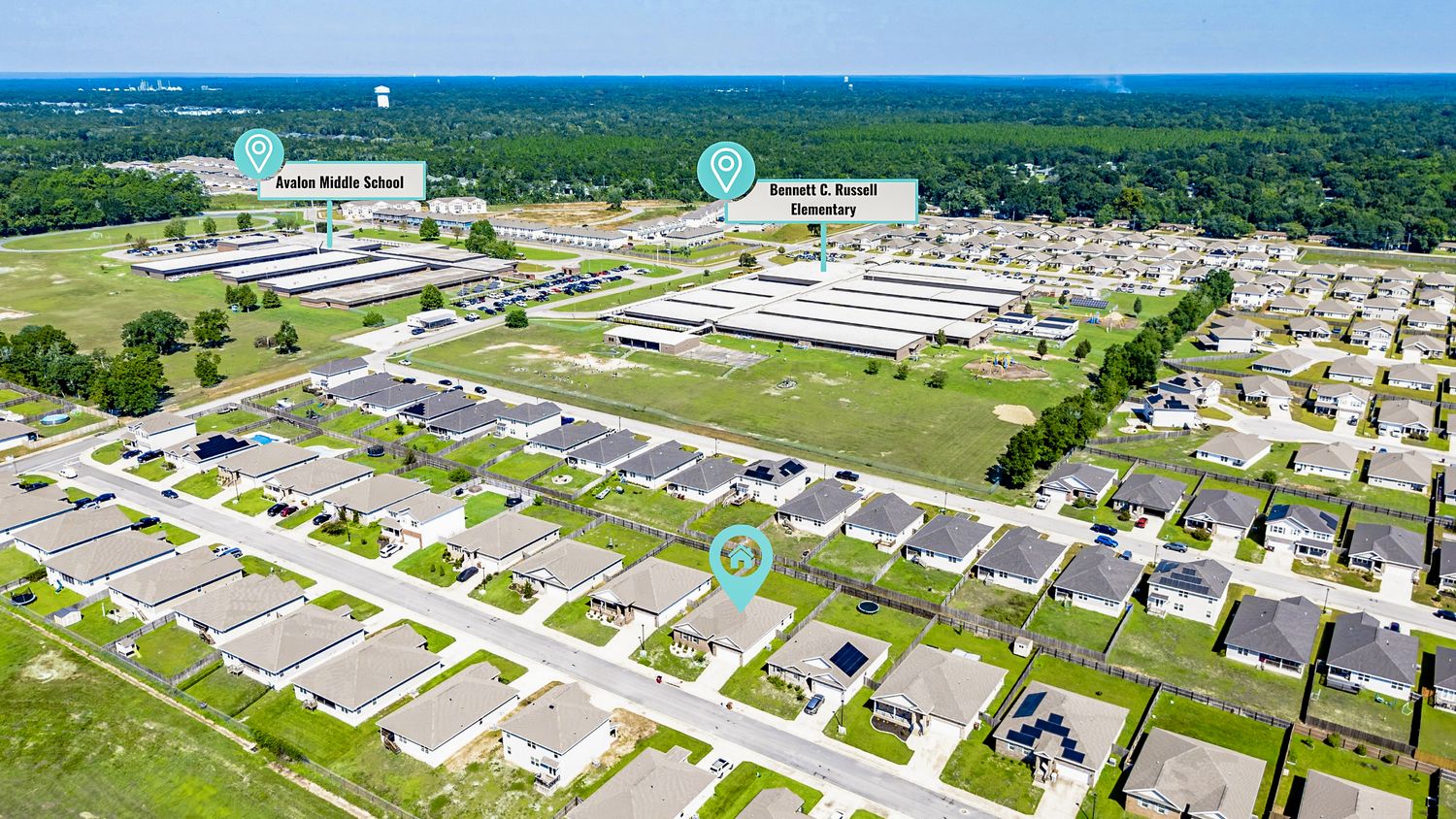 Aerial view of a suburban neighborhood near Avalon Middle School and Donald L. Tucker with rows of homes.