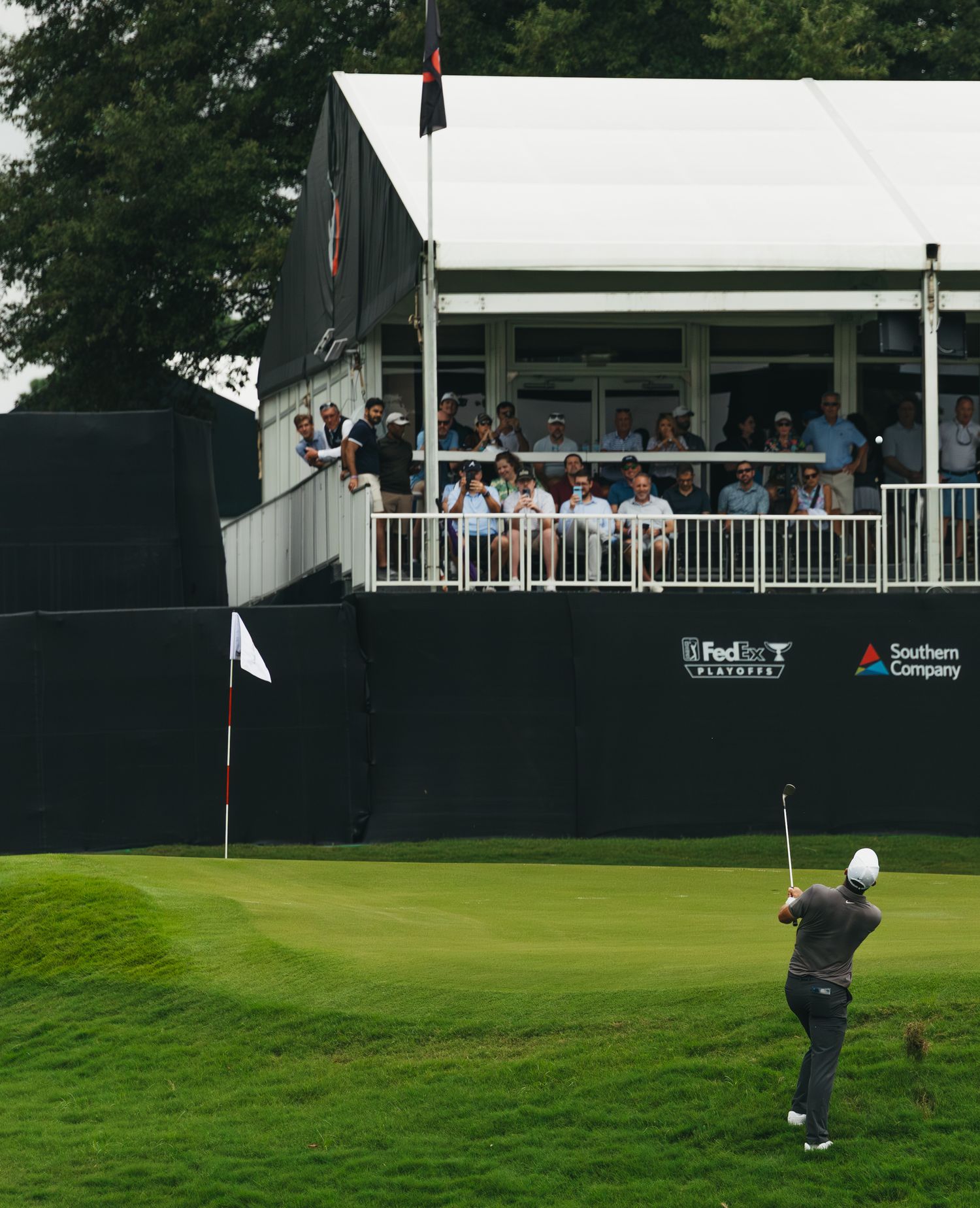 scottie scheffler hitting shot at pga tour championships