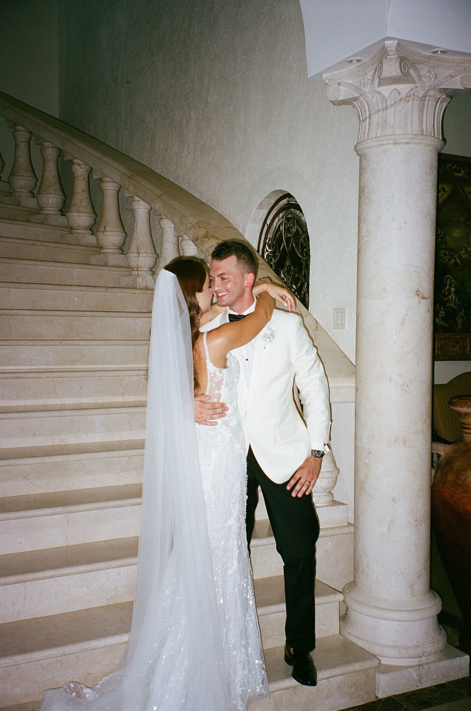 Newlyweds sharing a quiet moment after their wedding ceremony, photographed with a documentary approach
