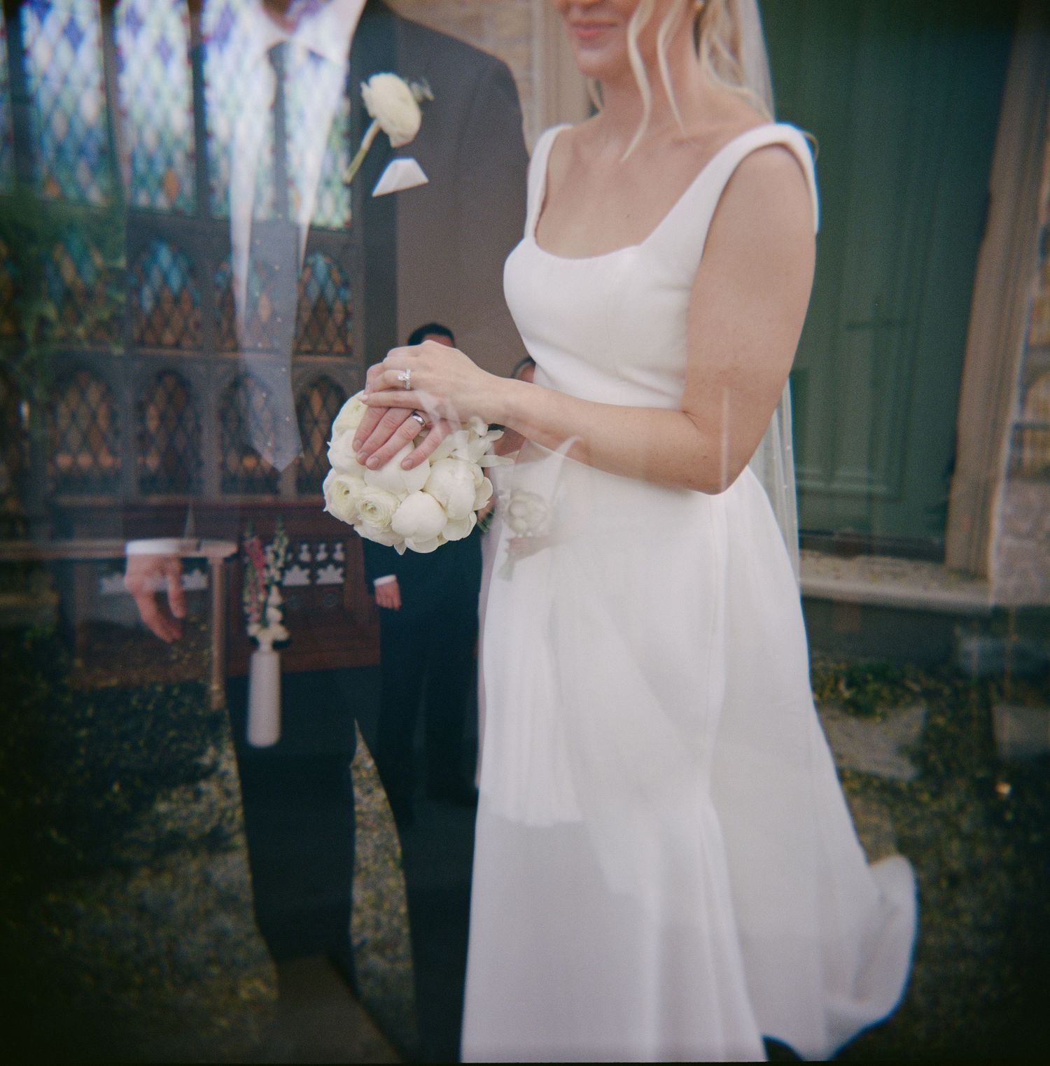 Intimate wedding portrait of a couple standing together in soft natural light in Toronto, Ontario