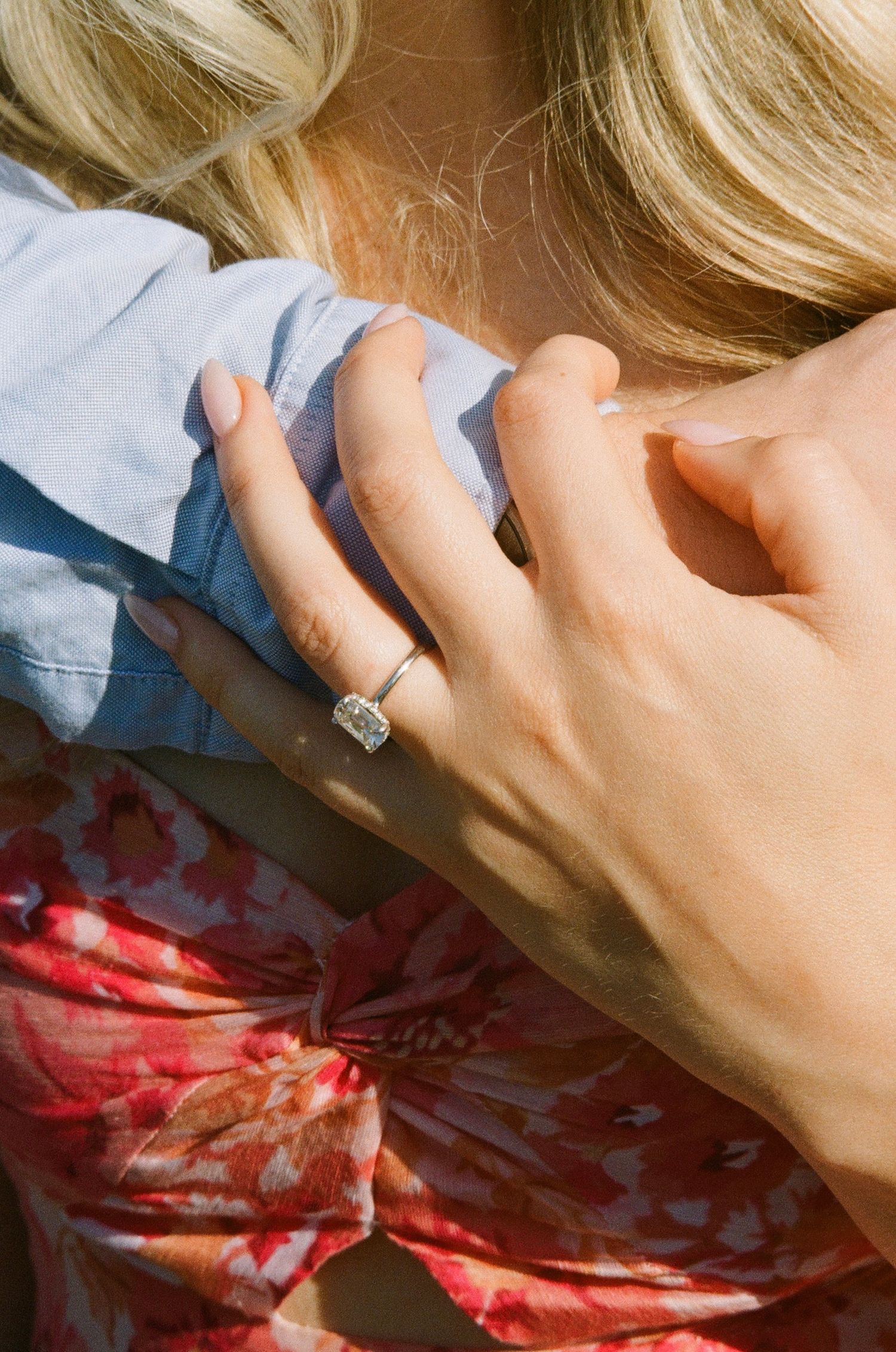 Couple embracing outdoors during their Toronto wedding, photographed in a natural documentary style.