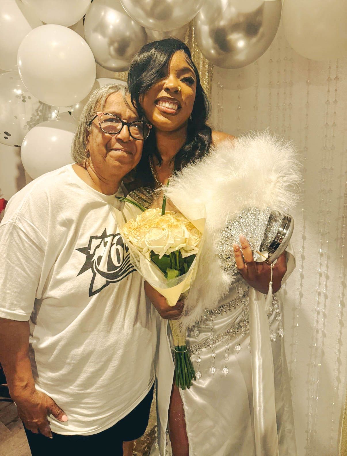 “A radiant moment framed in white and silver—capturing celebration, connection, and the beauty of a shared milestone.”