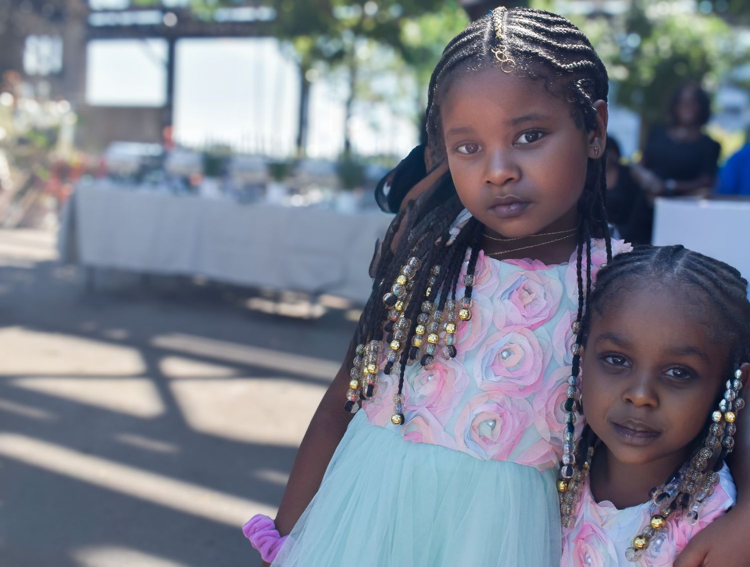 “Soft light, pastel tones, and sweet connection—capturing childhood warmth and togetherness in a beautifully candid moment.”