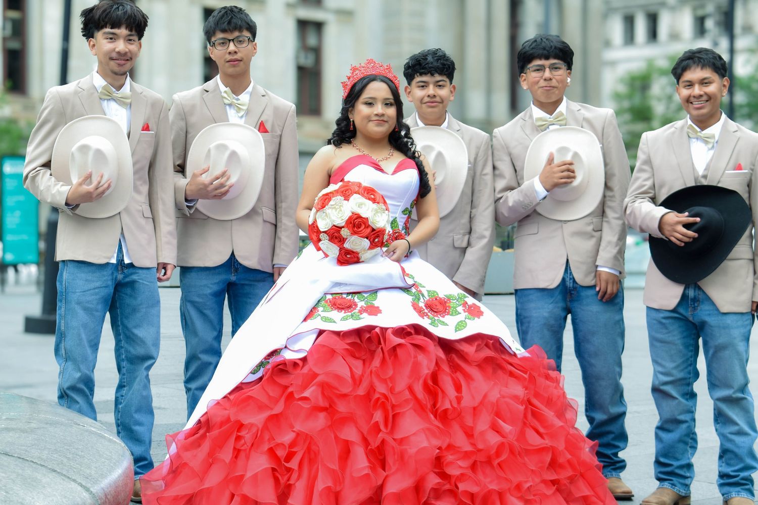 “A vibrant red gown meets soft neutrals, creating a striking contrast wrapped in unity, support, and a beautifully connected moment.”