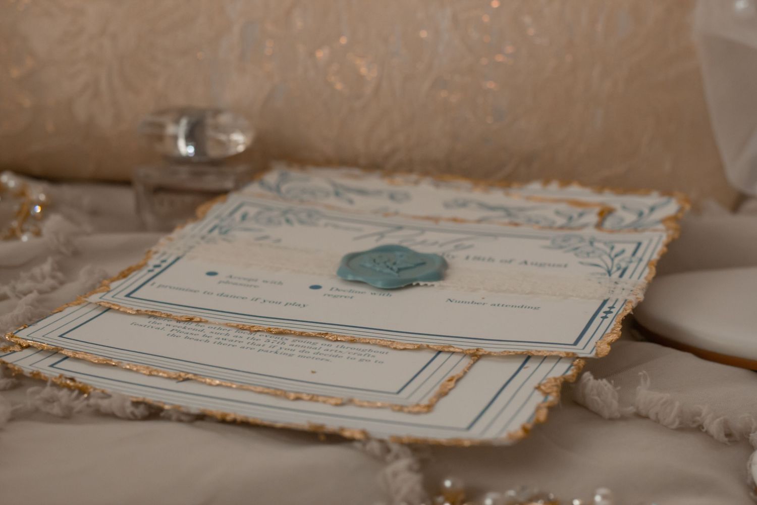 picture of wedding invitations and rings