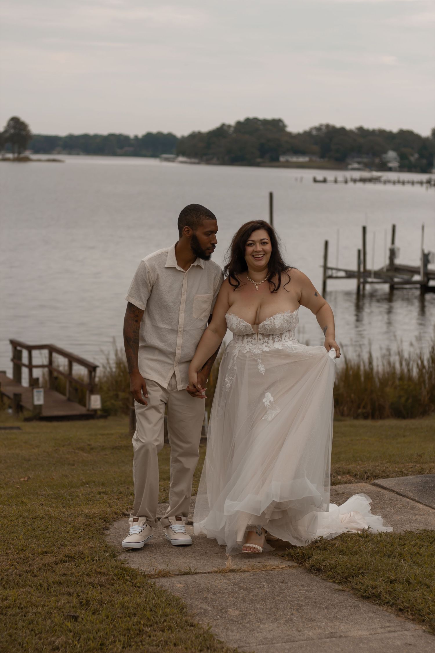 picture of couple at dock walking towards camera