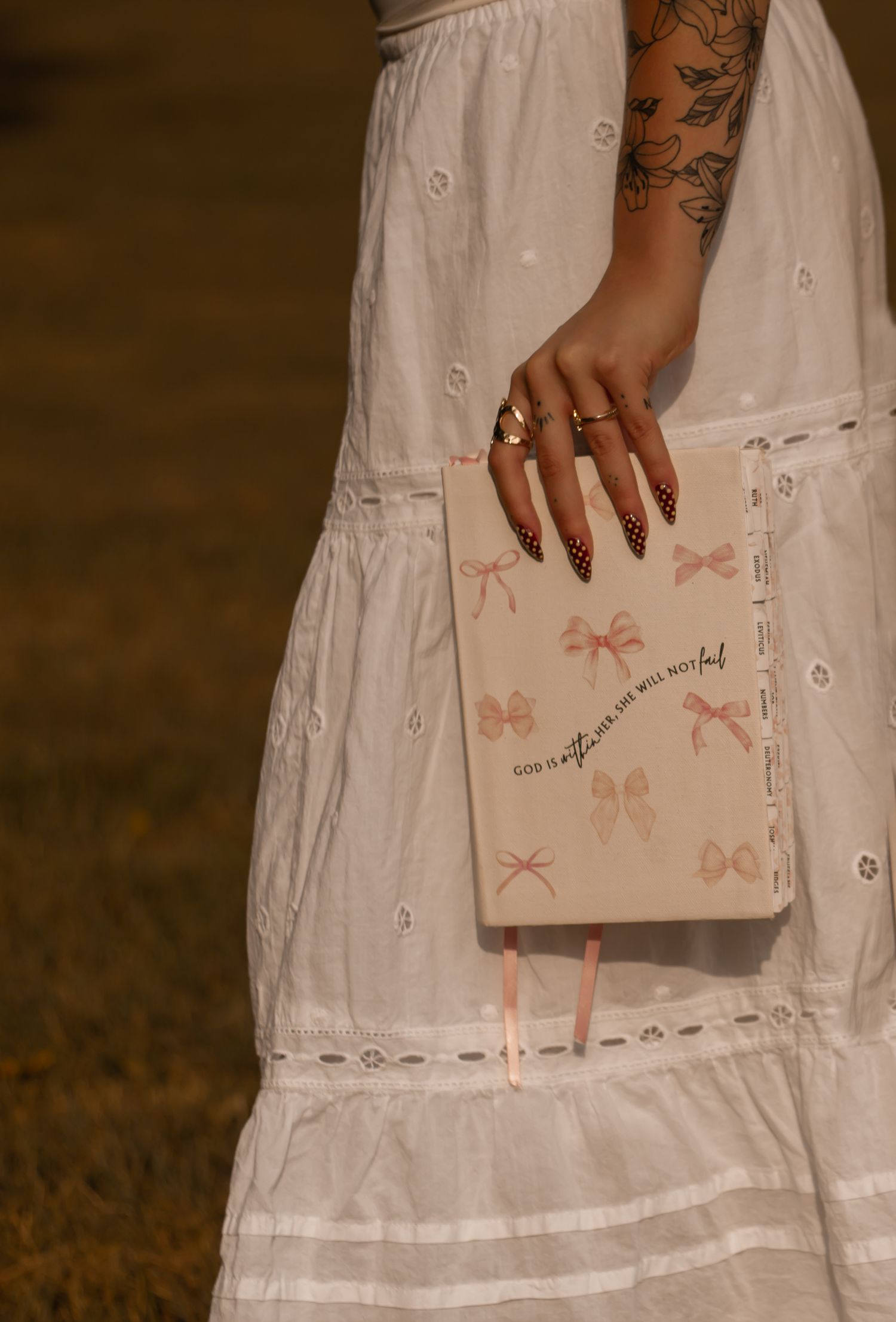 picture of girl holding the bible. waist down.