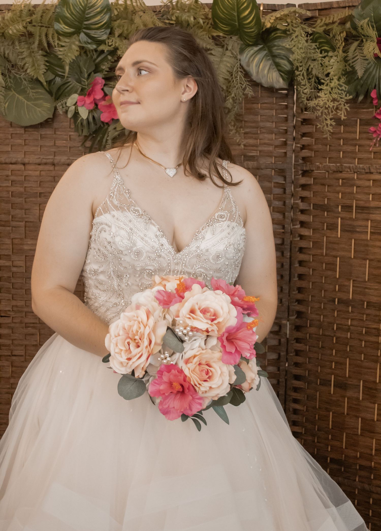 picture of bride holding her bouguet looking away