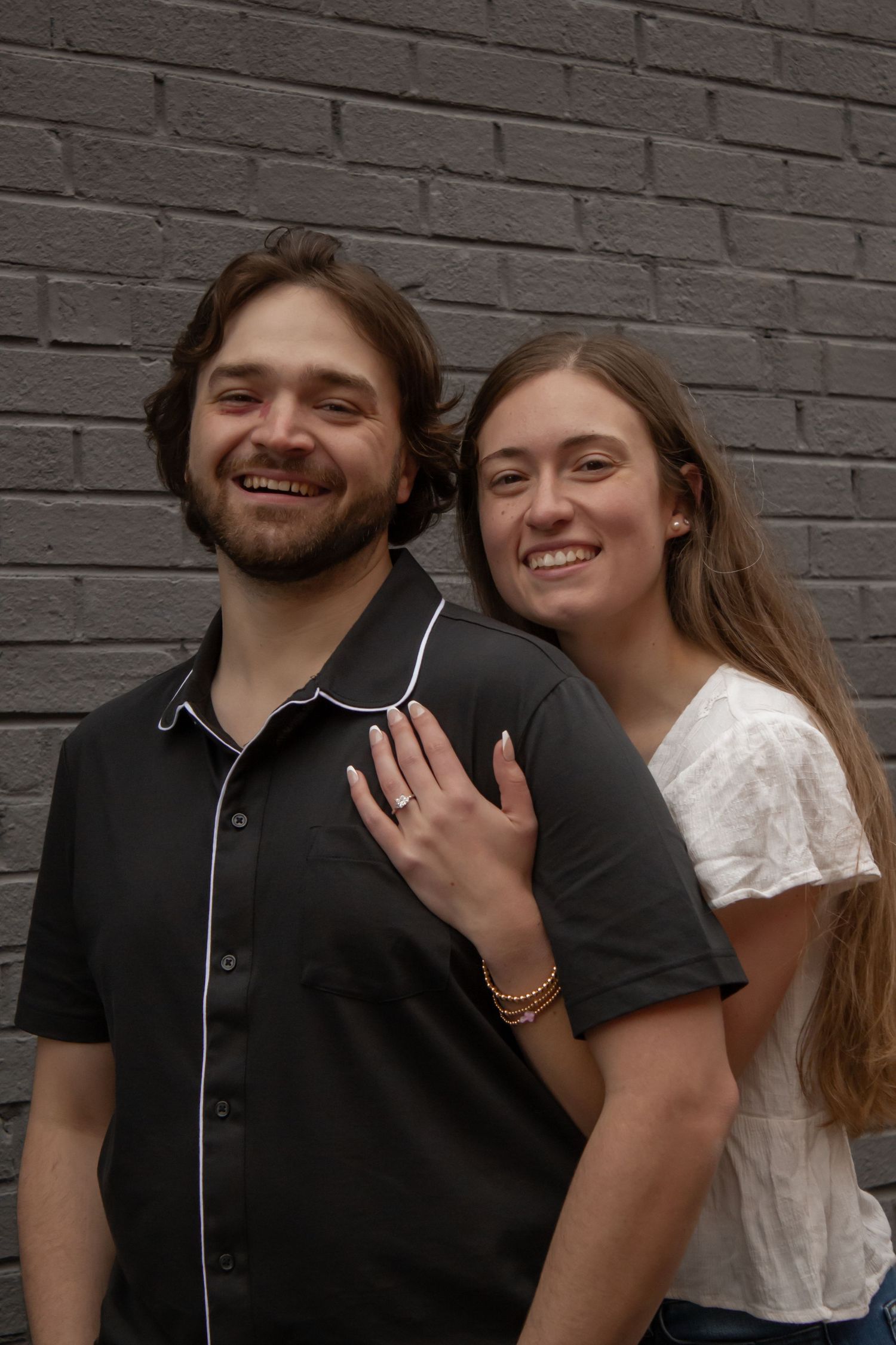 picture of couple, engagement, looking at camera