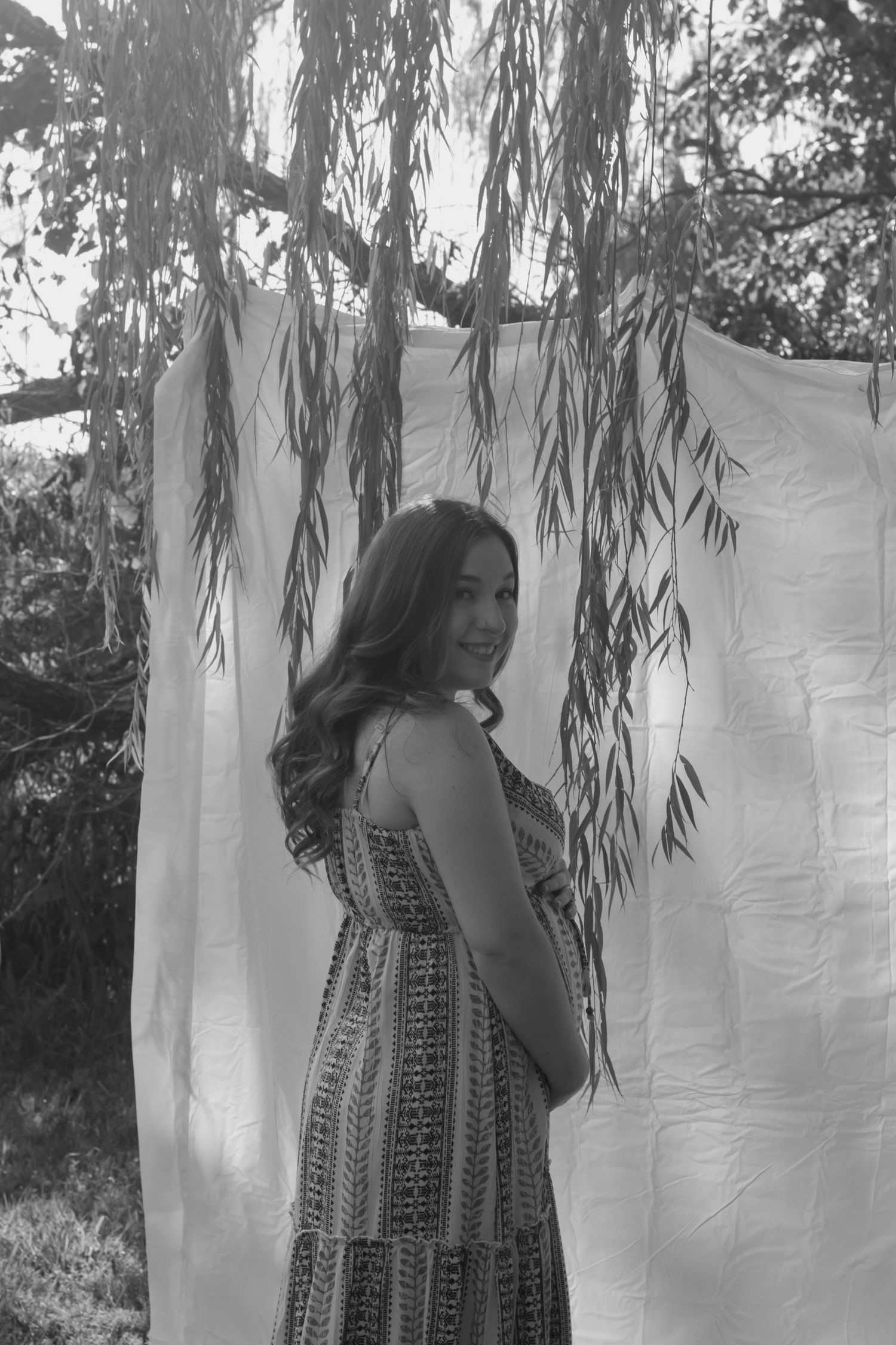 picture of mama to be, golden hour moment in black and white.