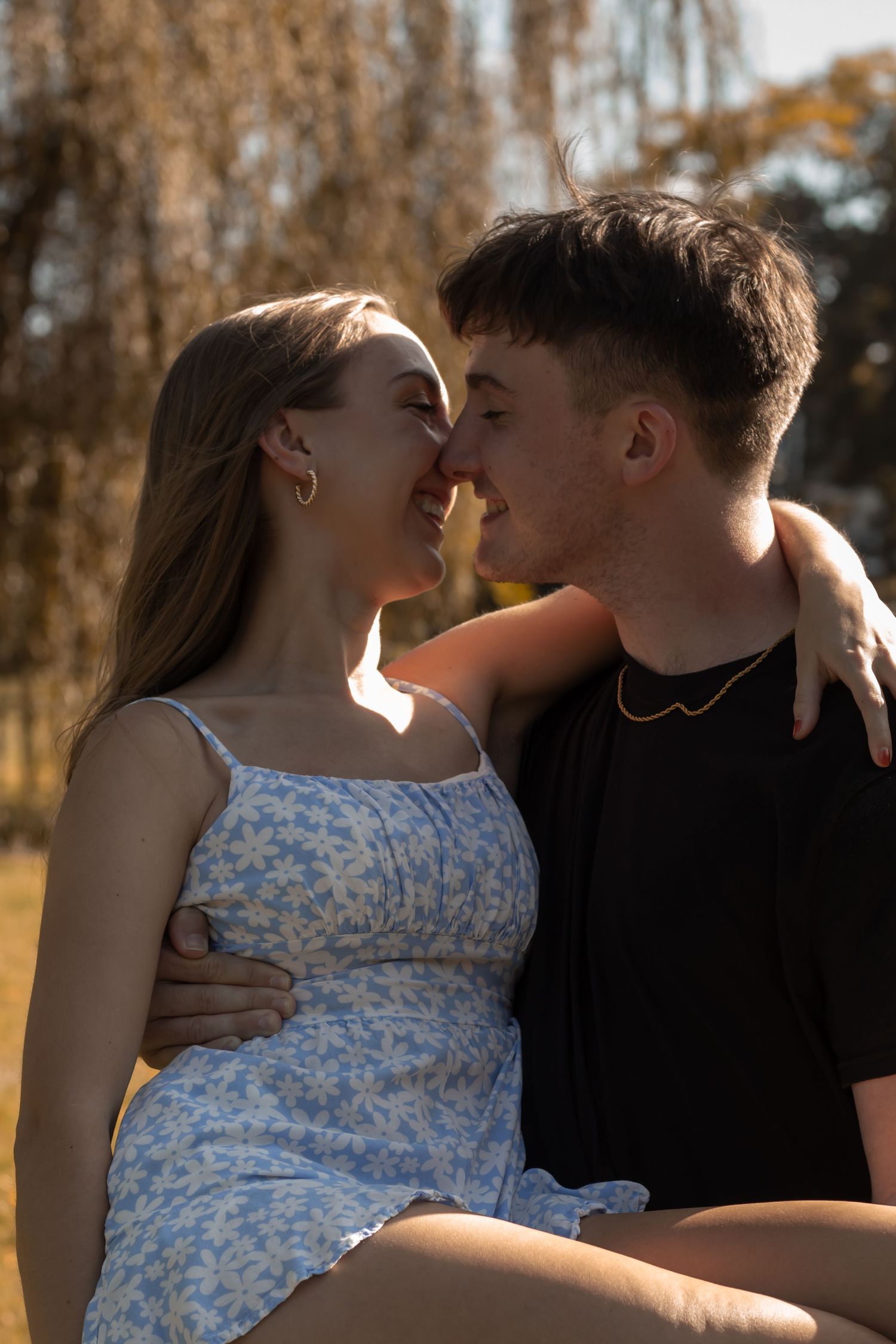picture of couple about to kiss. golden hour