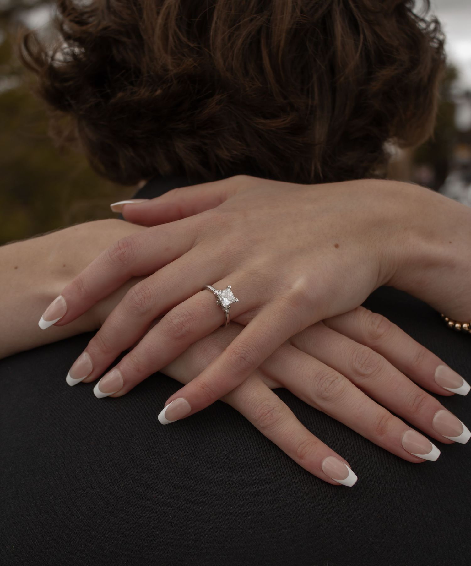 picture of hands, engagement ring focal point
