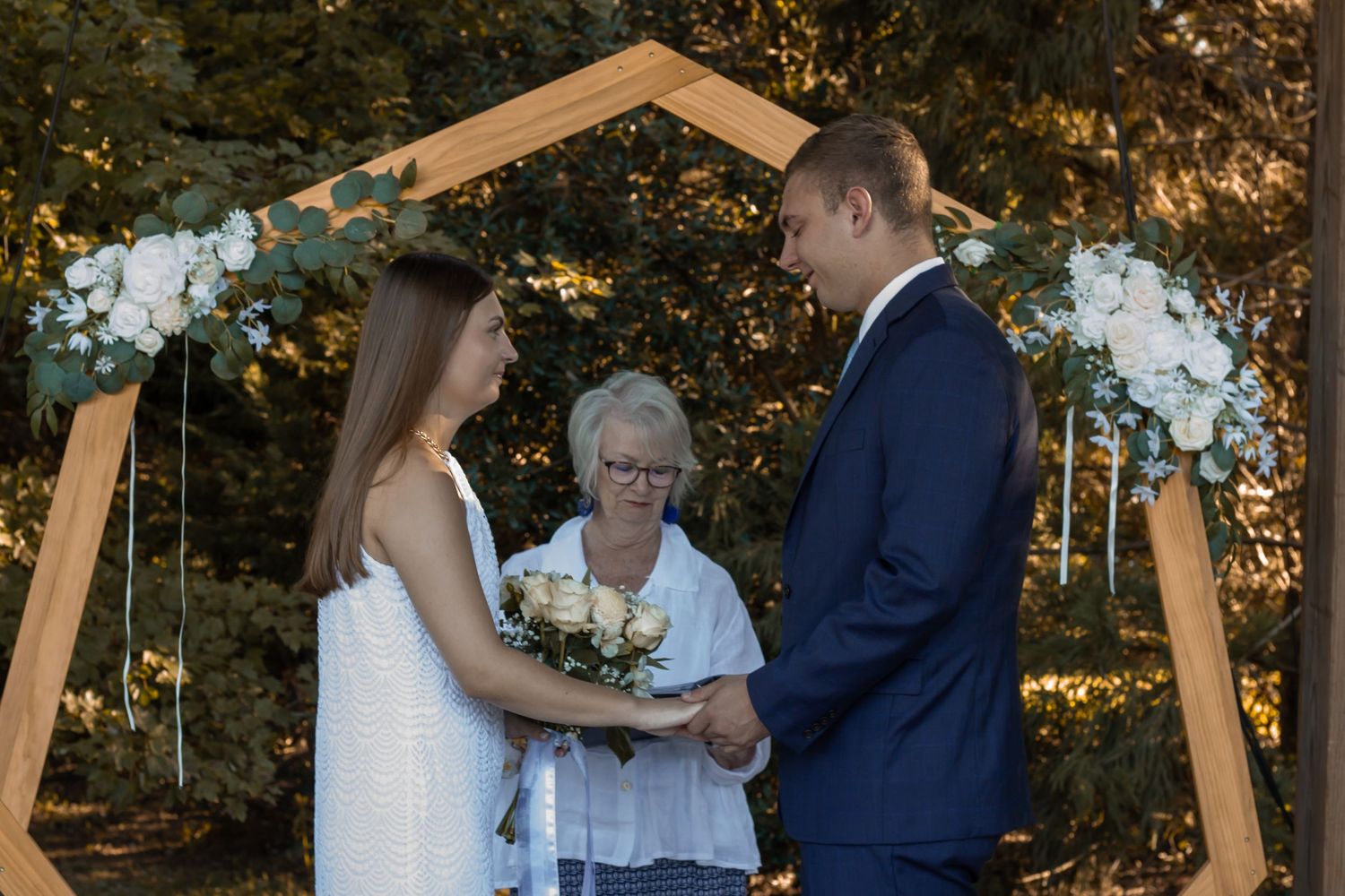picture of couple at their wedding ceremony about to say 