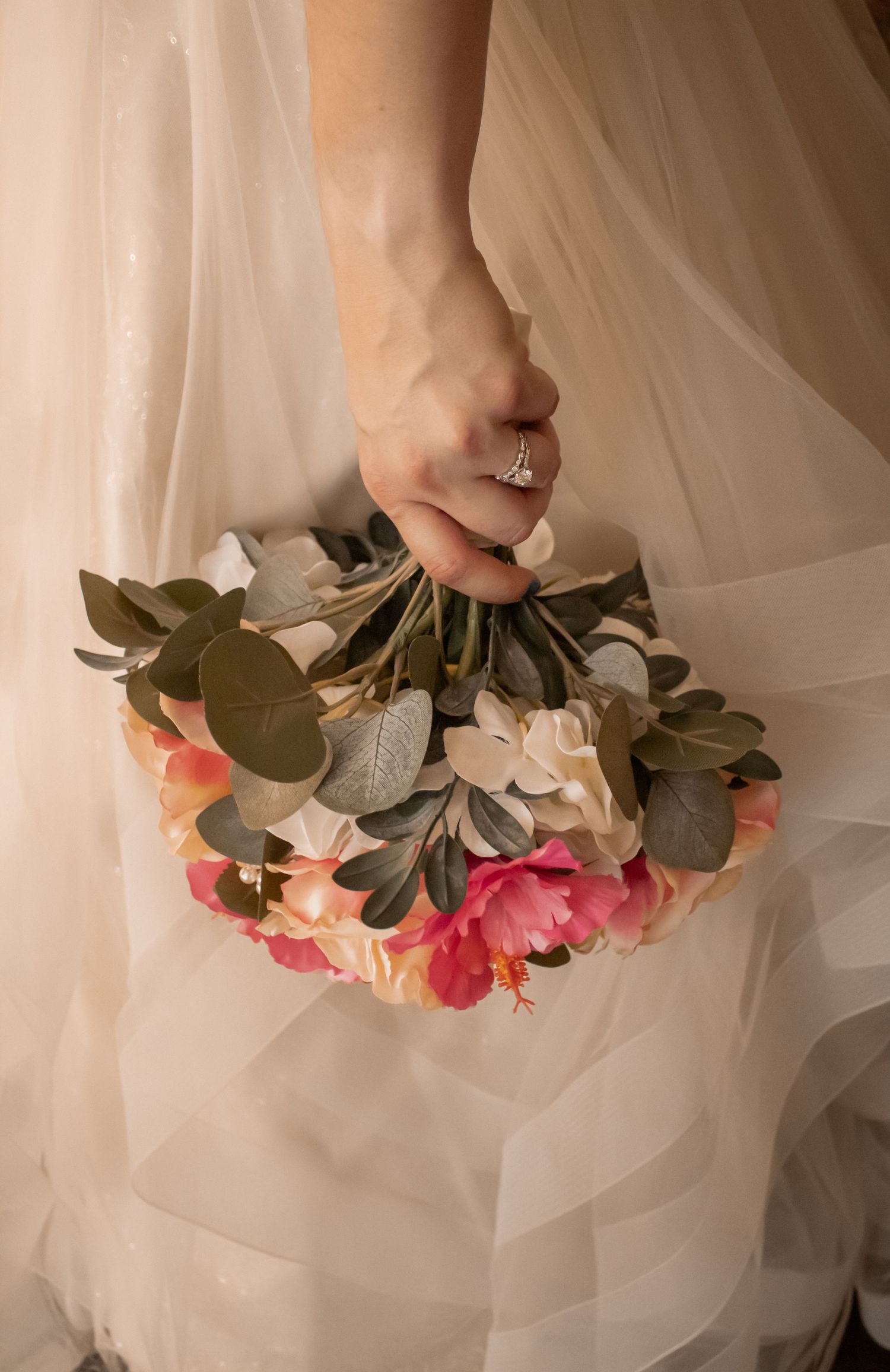 picture of bride's hands holding her bouquet down