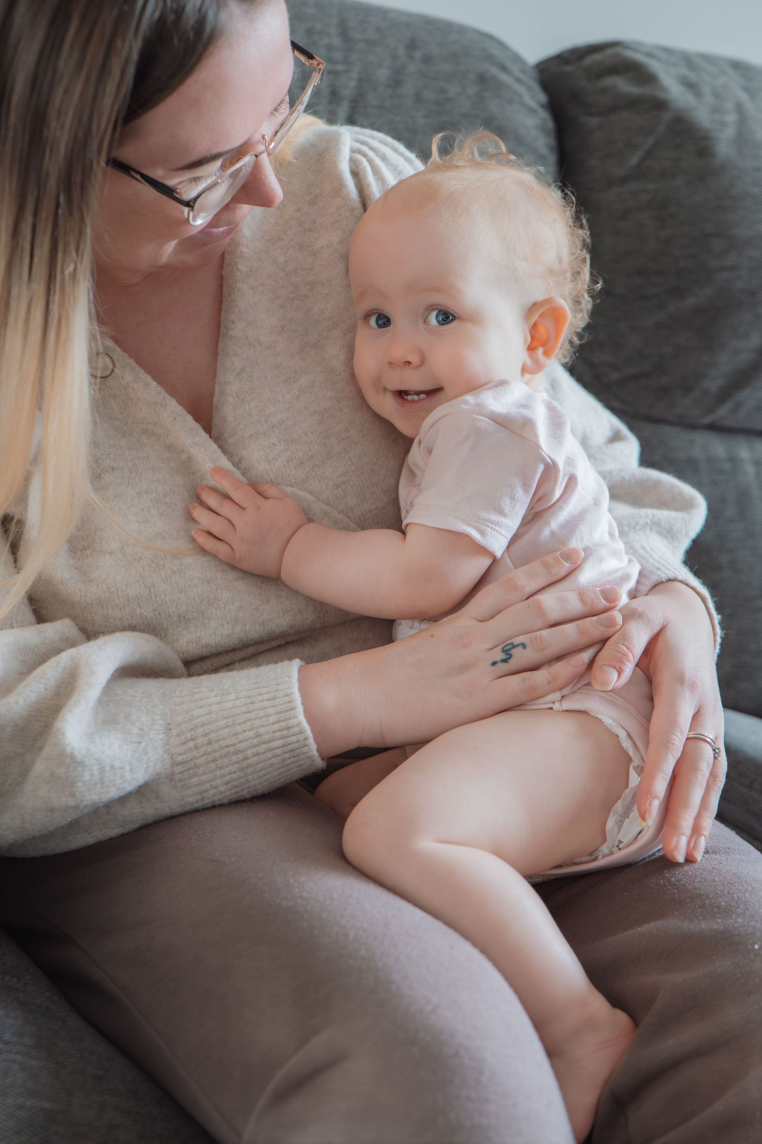Mother and baby sharing a cuddle captured documentary style in Dorset, UK