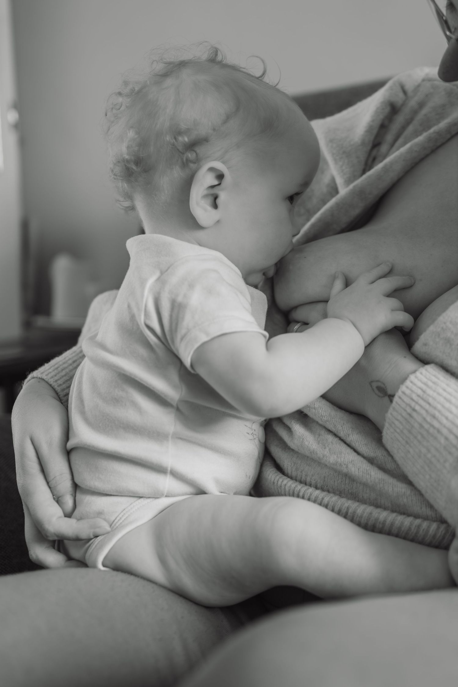 Close-up breastfeeding connection between mother and baby