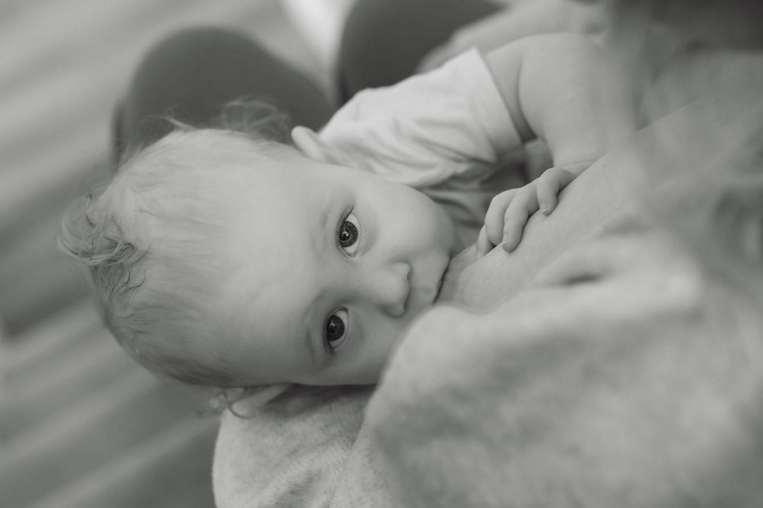 Breastfeeding photography session with mother and baby