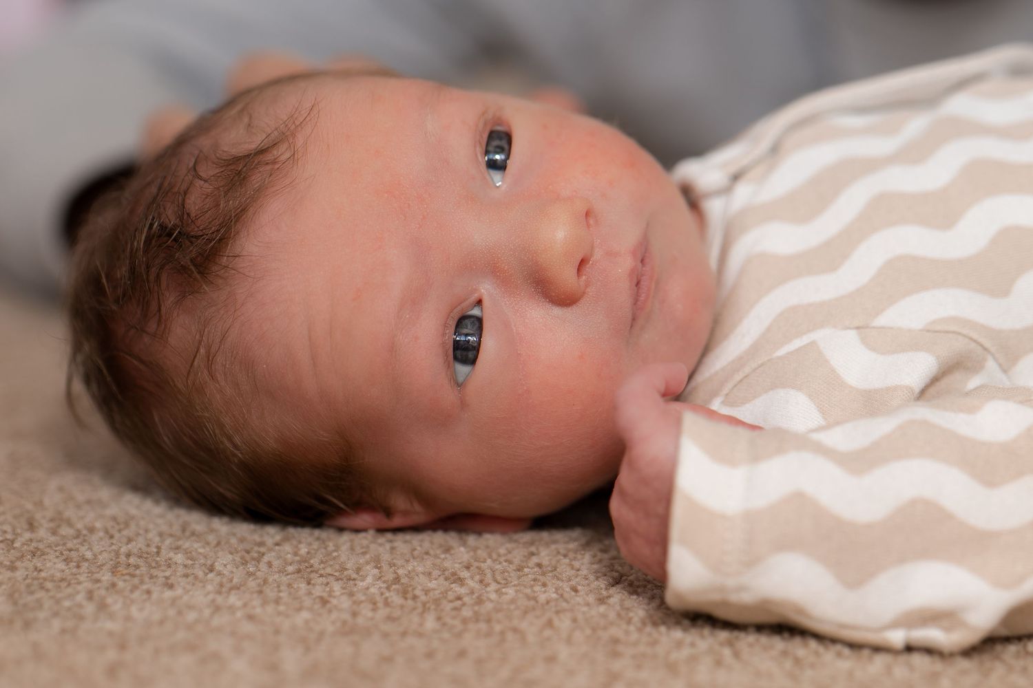 Relaxed newborn baby photography session