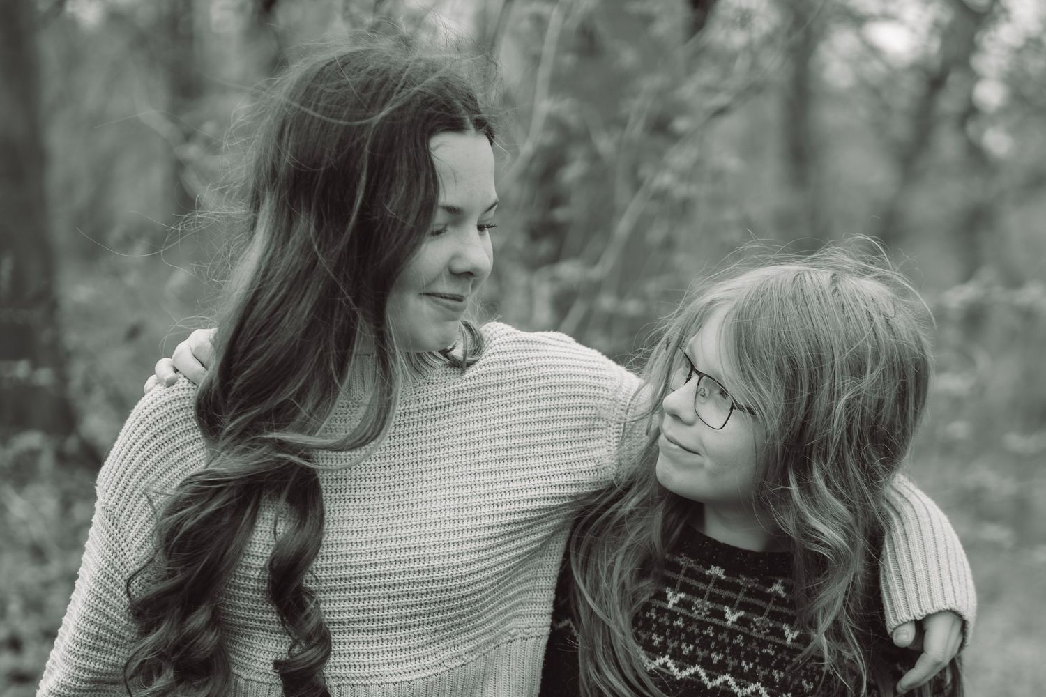 Brother and sister share a tender moment during photography session
