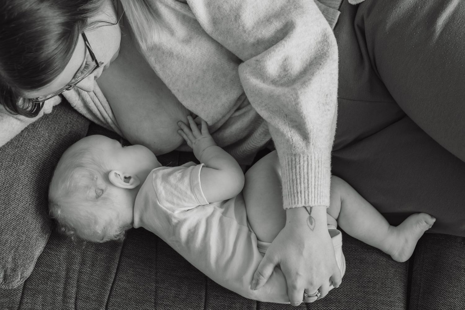 Candid breastfeeding photography at home