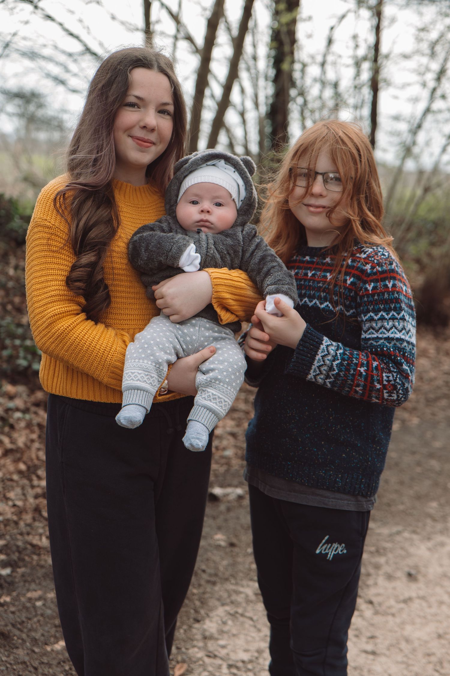 Siblings smile during connection-based family photography